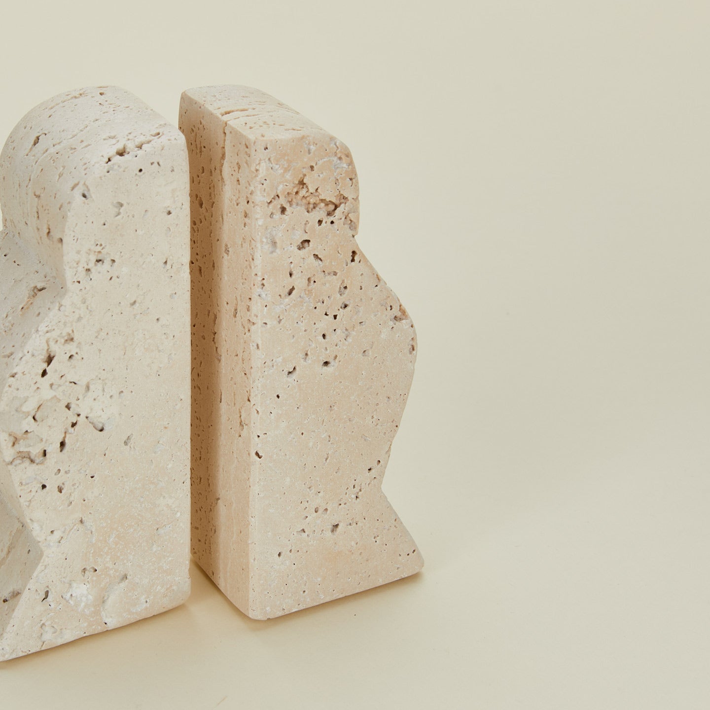 Detailed view of Bloomingville travertine wave bookends