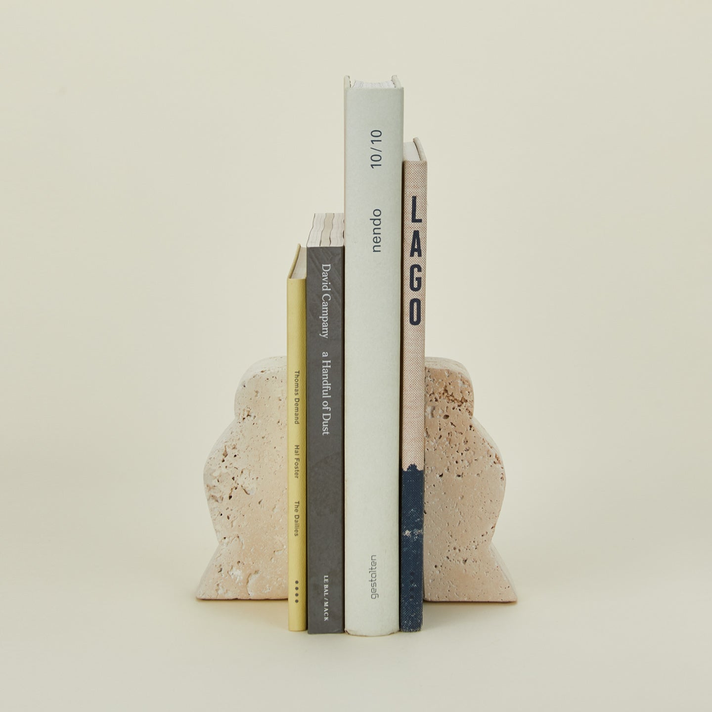 Bloomingville travertine wave bookends with books