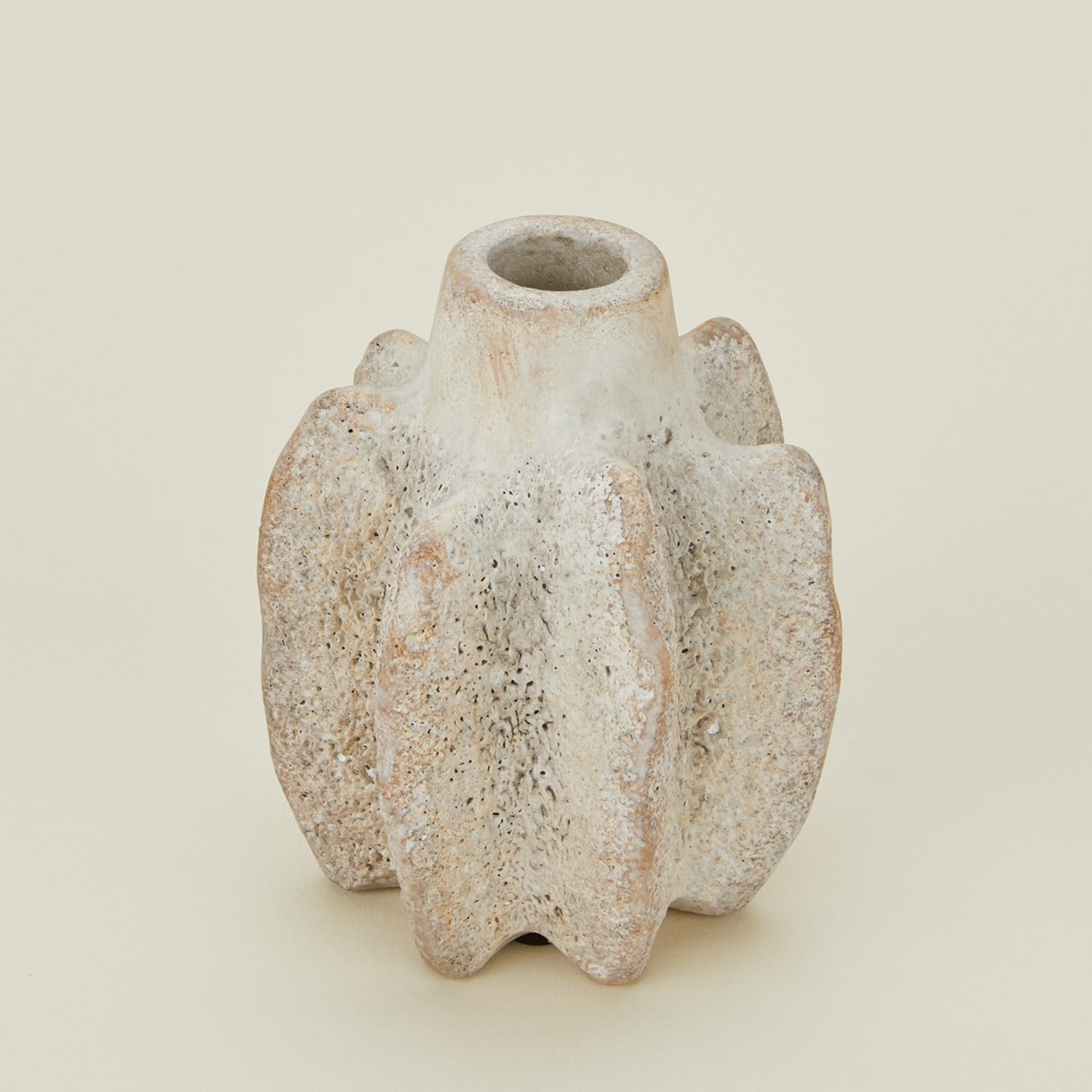 Close up view of tall brutalist candle holder