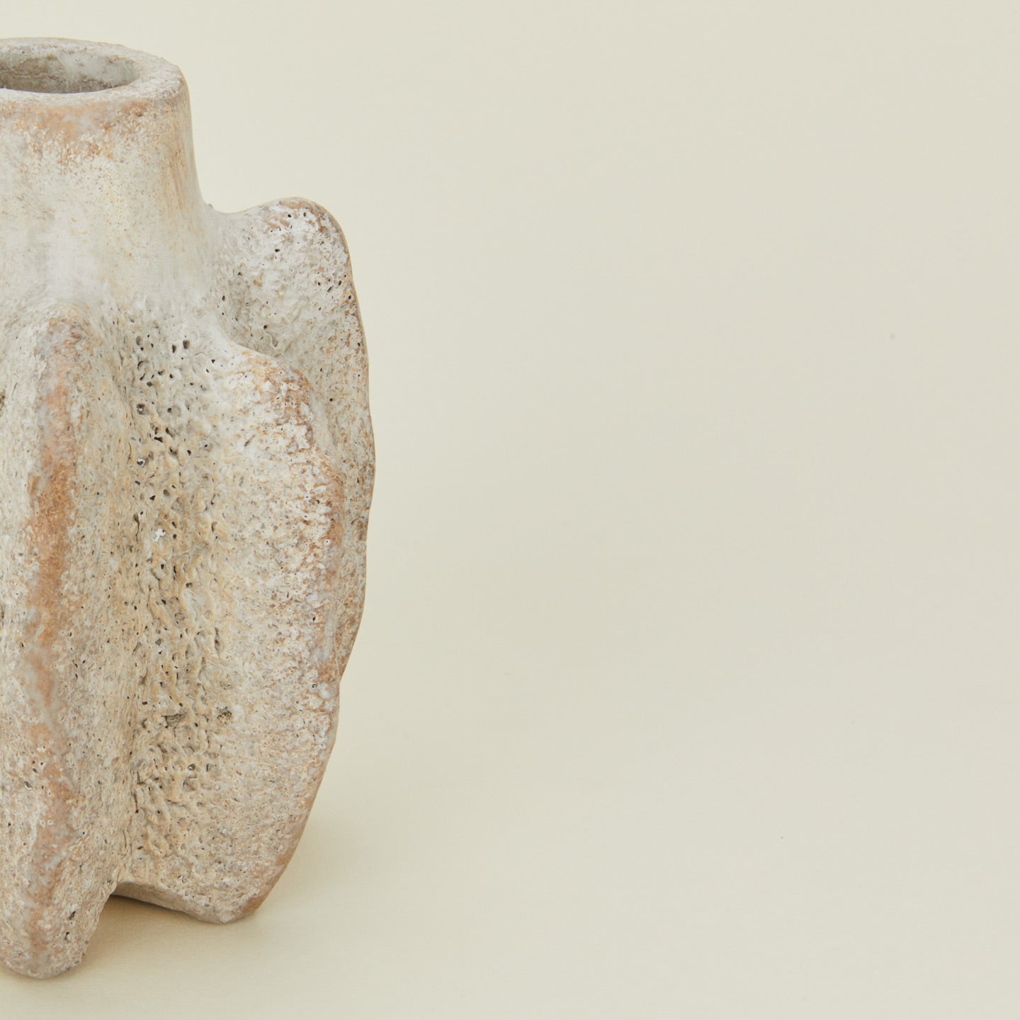 Detailed view of tall brutalist candle holder