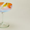 Close up view of bow glassware coupe in multicolor