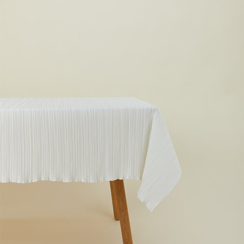 Cahaya tablecloth in ivory on table
