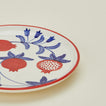 Close up view of Casa Amarosa pomegranate plate