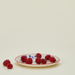 Casa Amarosa pomegranate plate with raspberries