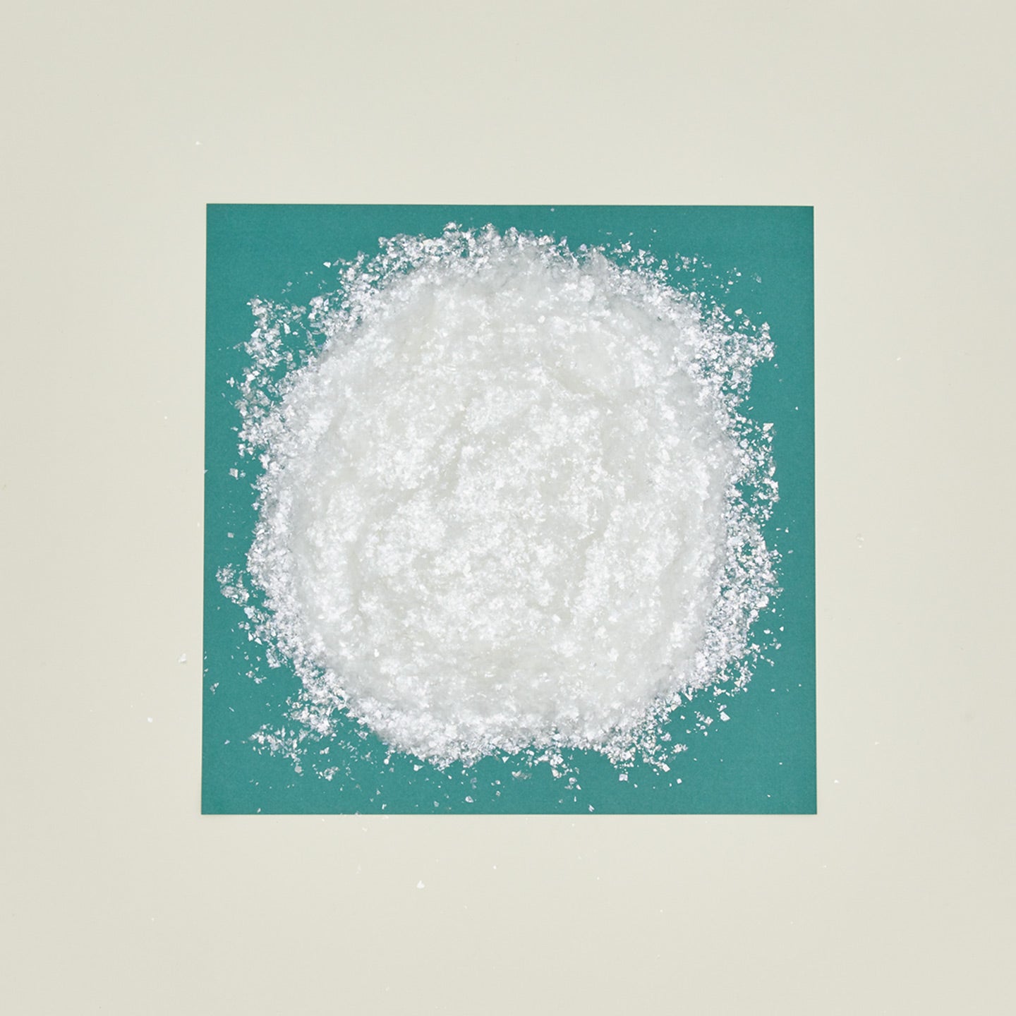 Faux snow on turquoise paper