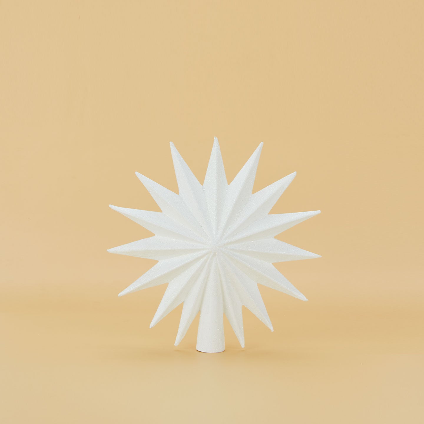 White 16 point star tree topper.