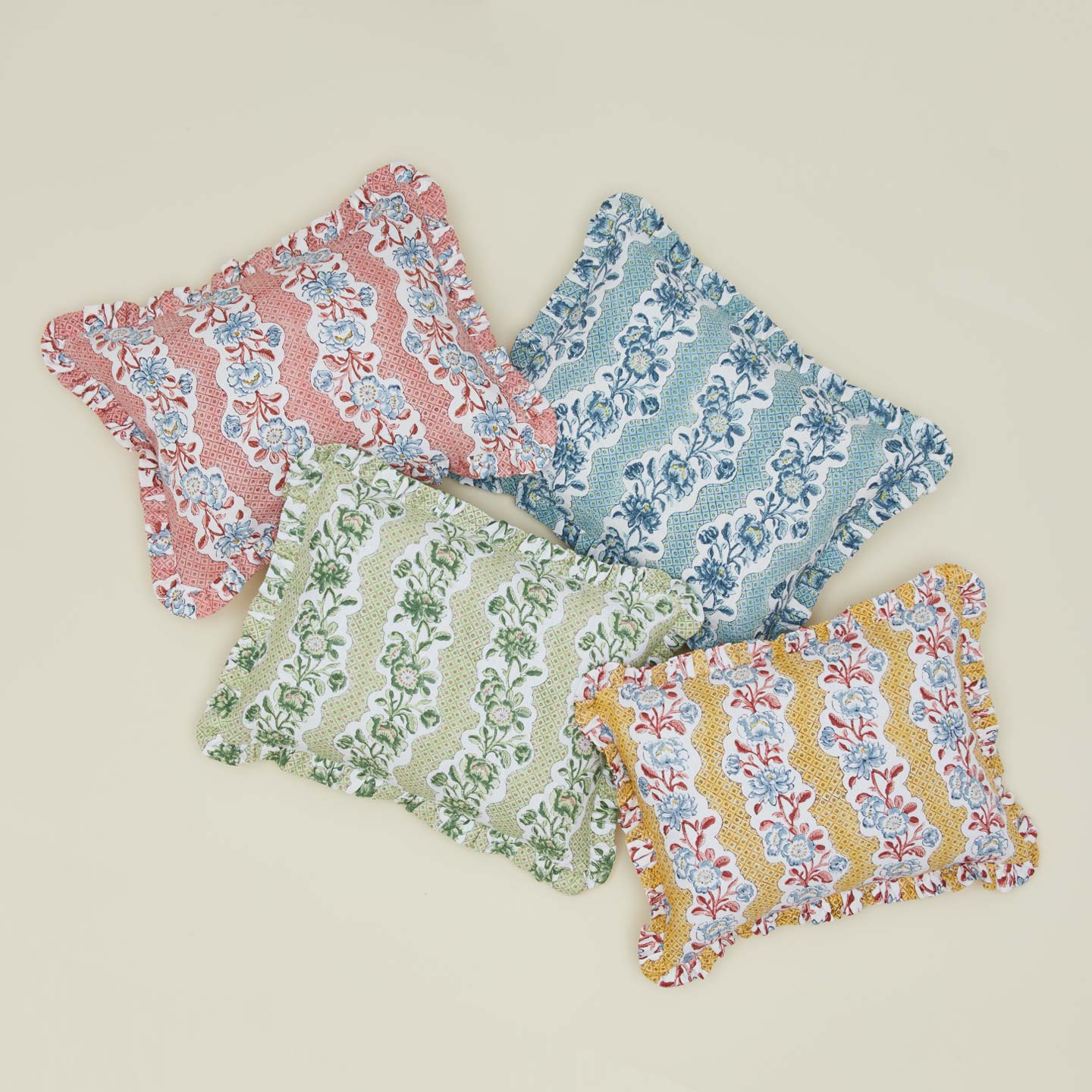 Floral block printed pillows in various colors.