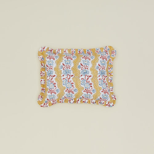 Block printed floral ruffled pillow in mustard.