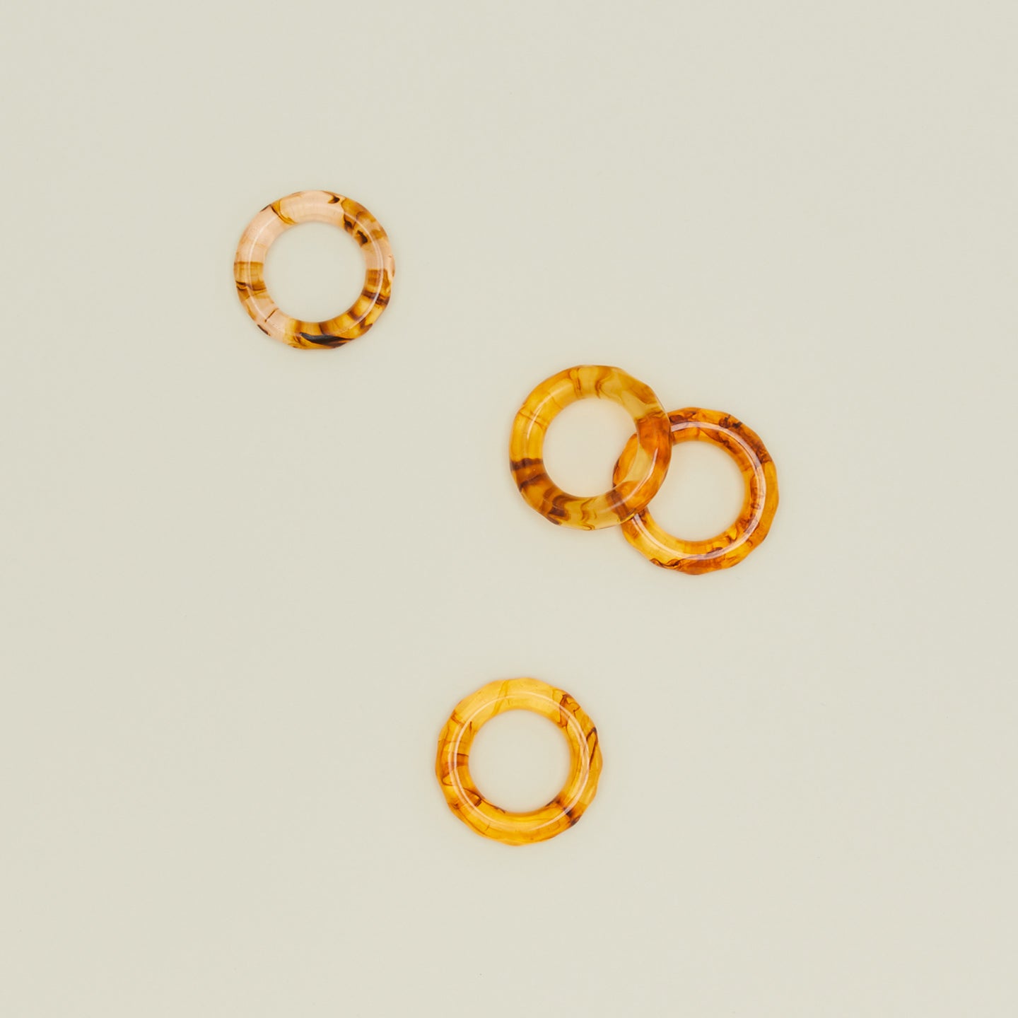 Overhead view of toroiseshell napkin rings, set of 4