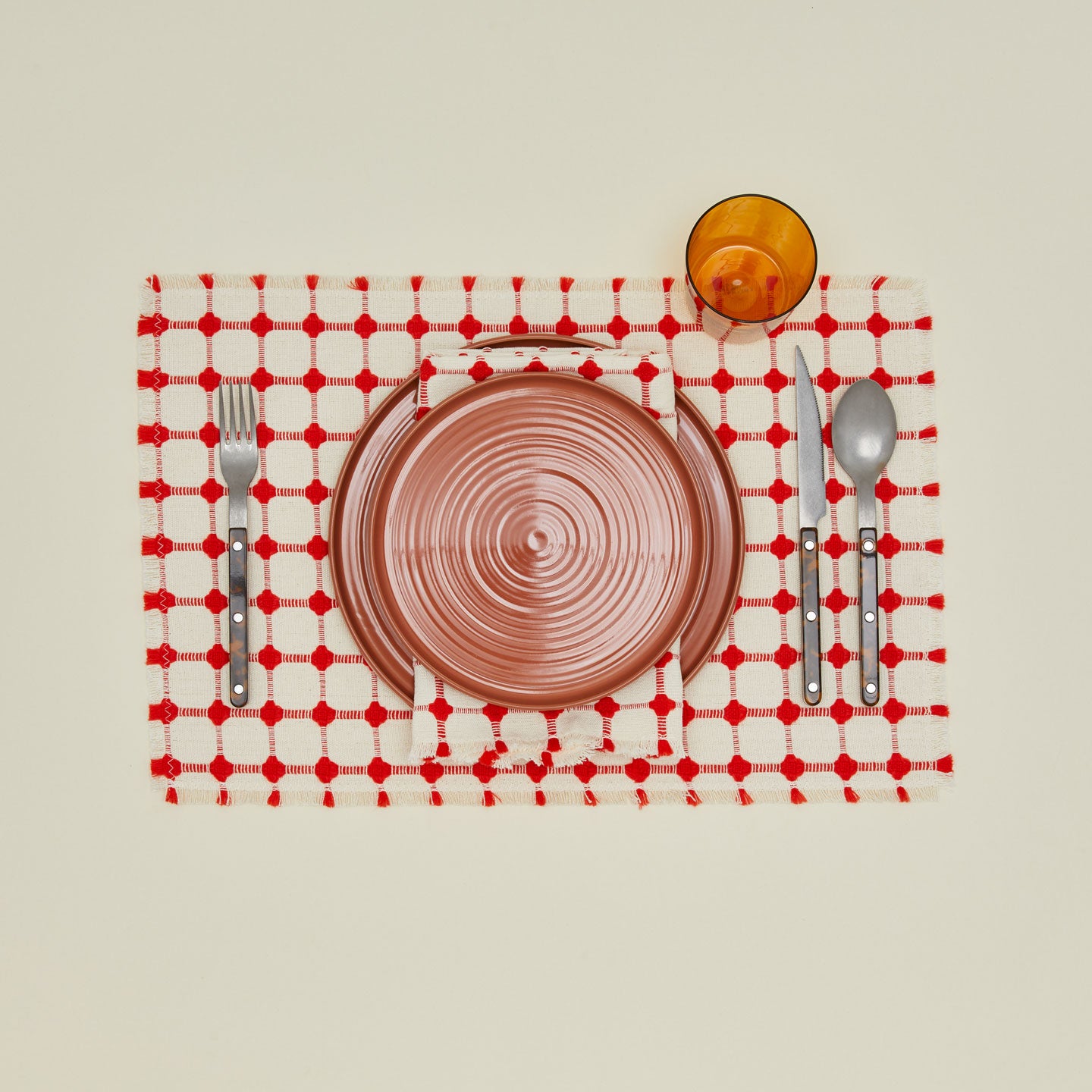 Dove and Donkey wicker fringed placemat in cherry with place setting