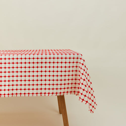 Dove and Donkey wicker fringed tablecloth in cherry on table