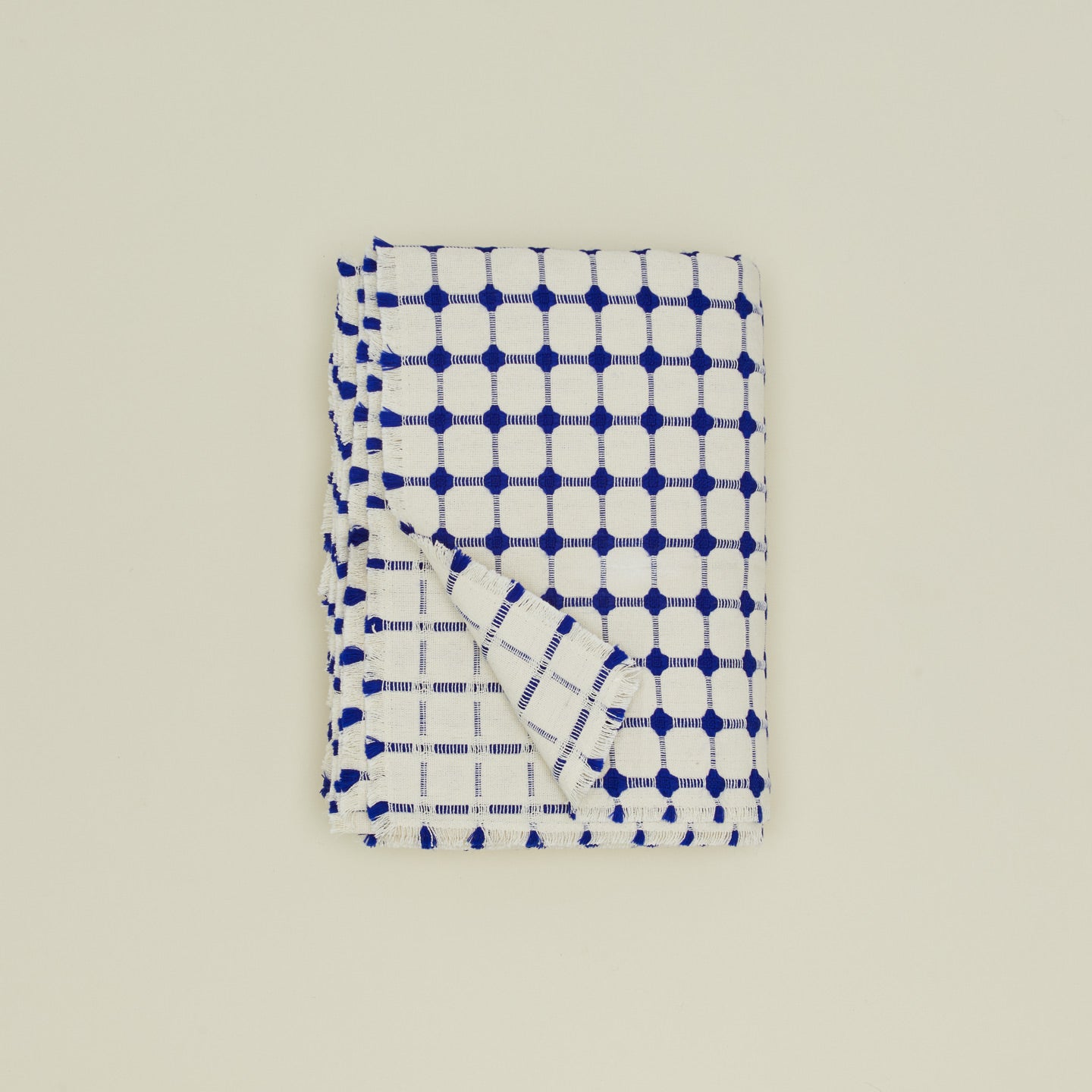Dove and Donkey wicker fringed tablecloth in cobalt