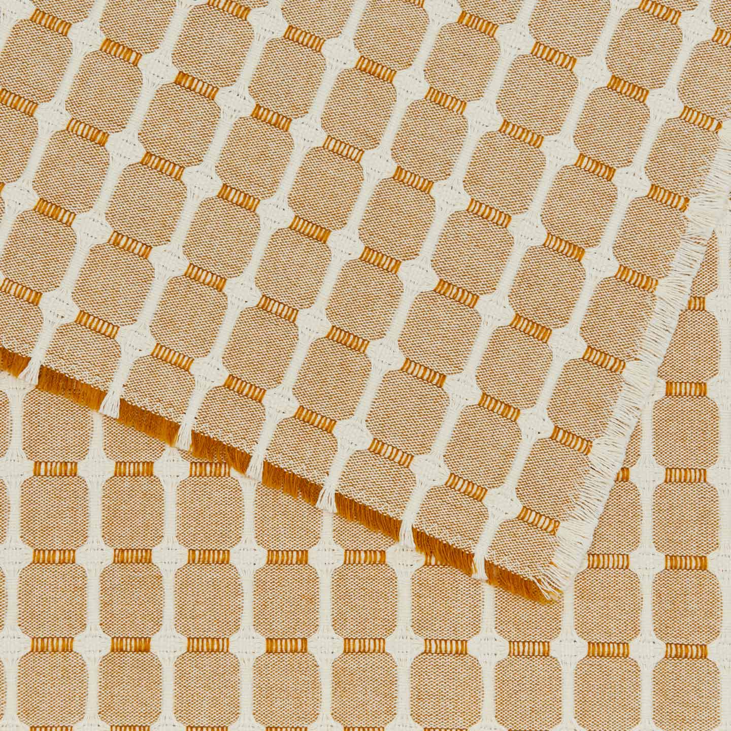 Close up view of Dove and Donkey hopsack placemat in honey