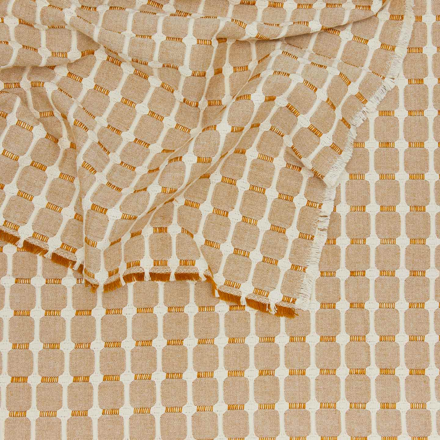 close up view of Dove and Donkey hopsack tablecloth in honey