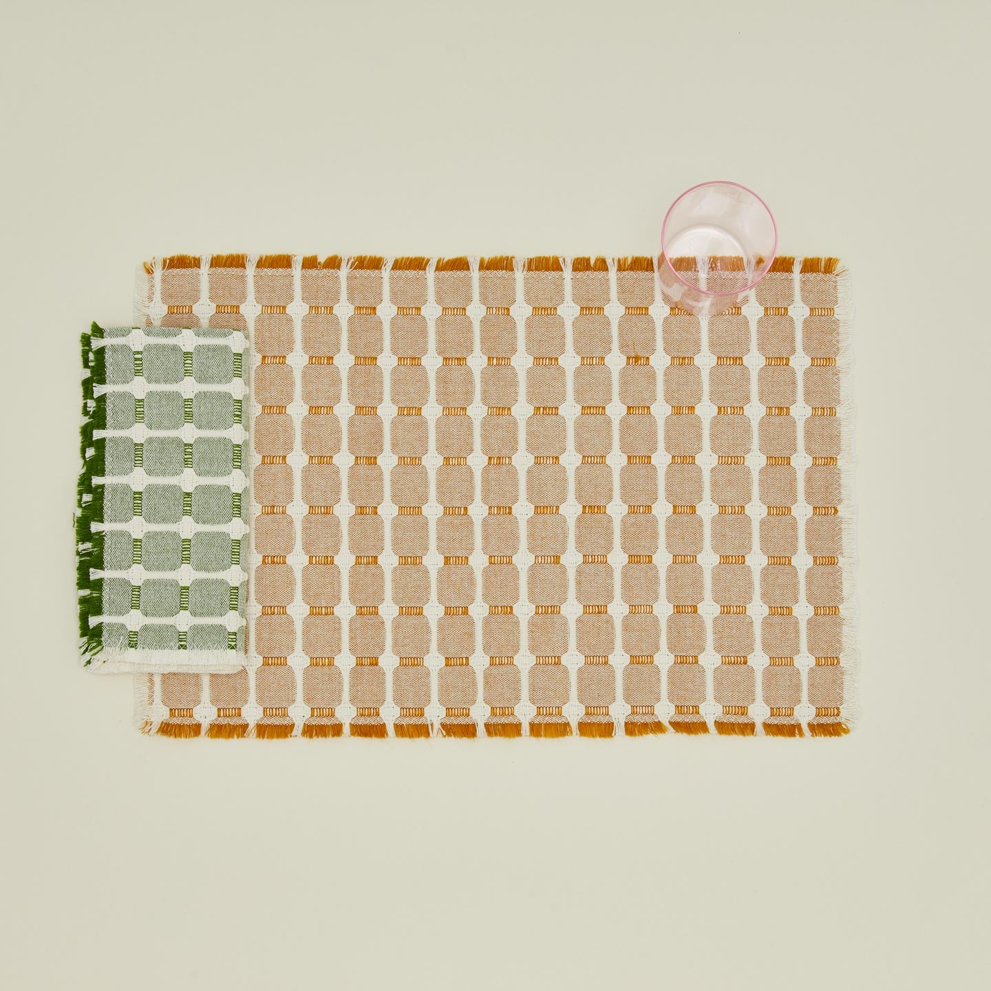 Dove and Donkey hopsack napkin in leaf with glass and placemat