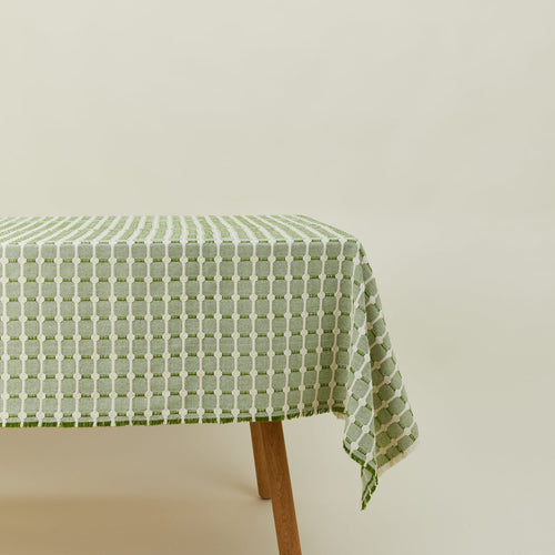 Dove and Donkey hopsack tablecloth in leaf on table