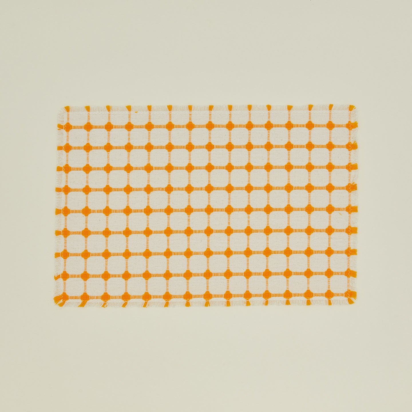 Dove and Donkey wicker fringed placemat in marigold