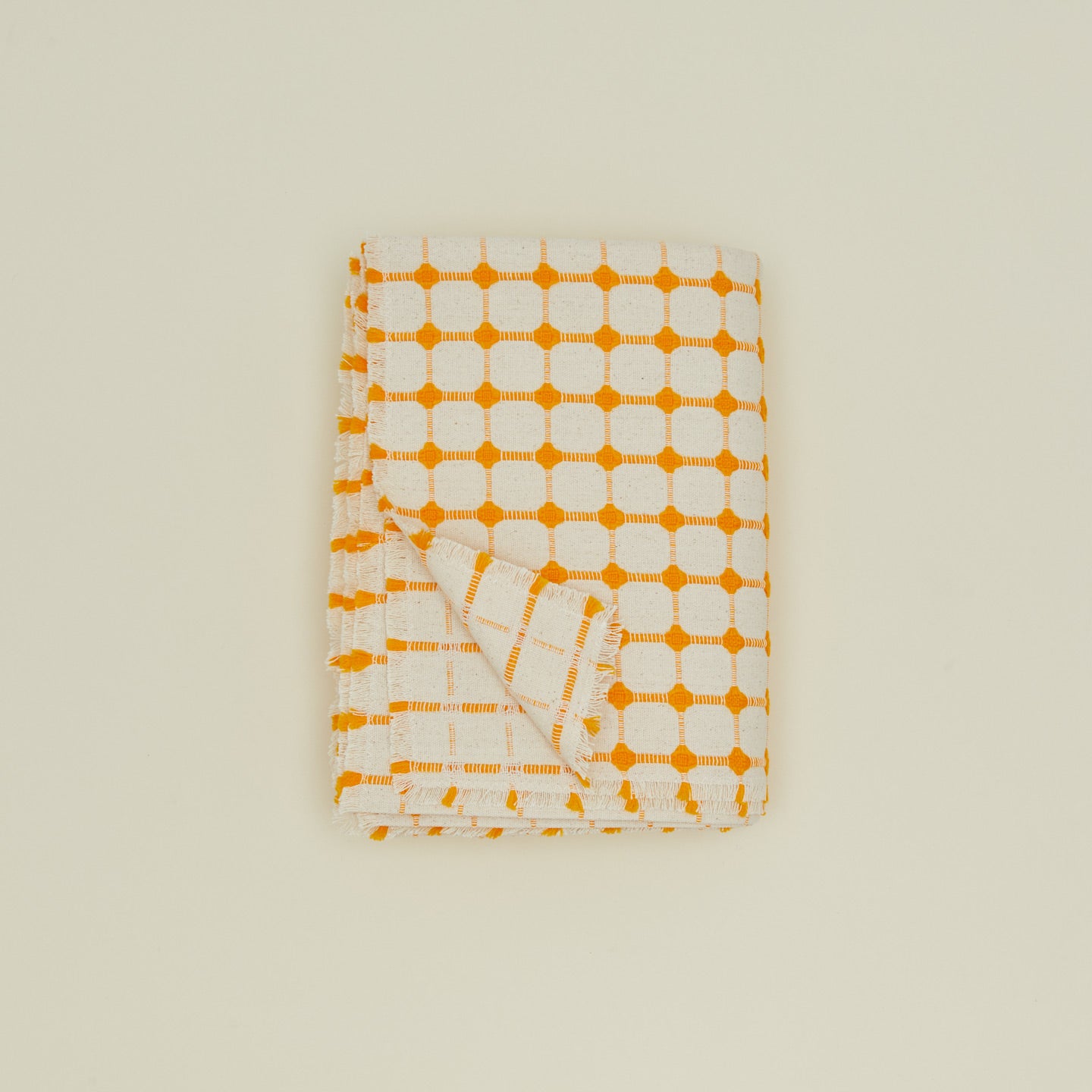 Dove and Donkey wicker fringed tablecloth in marigold