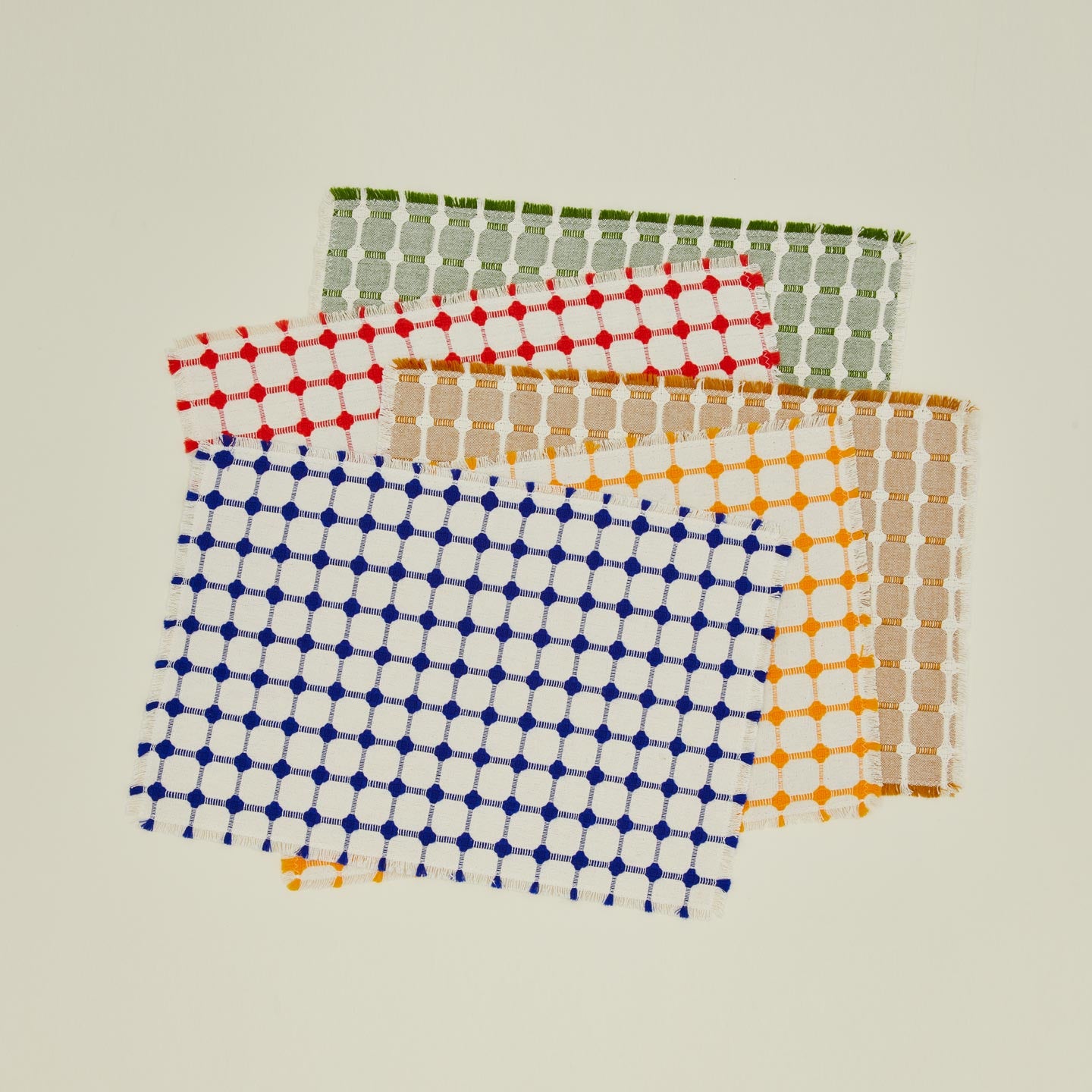Dove and Donkey wicker fringed placemats in various colors