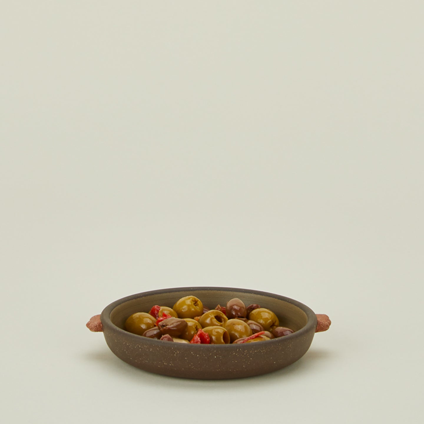 Stoneware nub saucer with olives