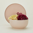Essential Serving Bowl and Serving Platter in Blush, with lettuces.