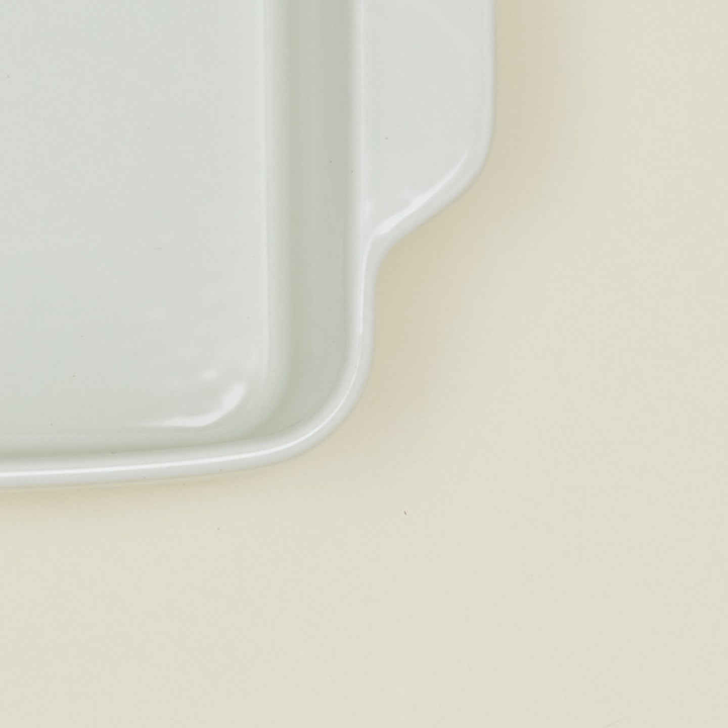 Close up view of 9" x 13" essential bakeware in bone