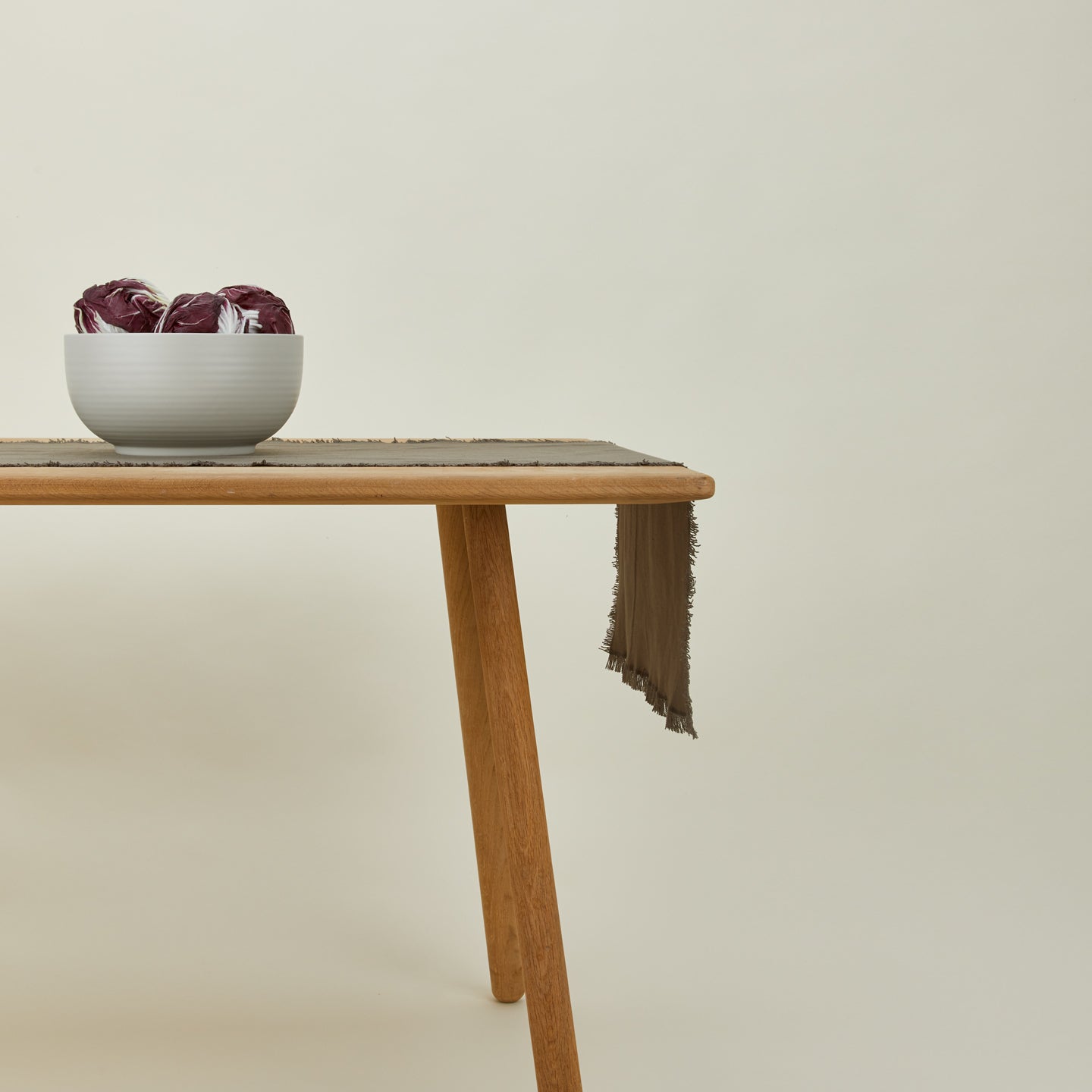Essential dark grey runner with serving bowl on table