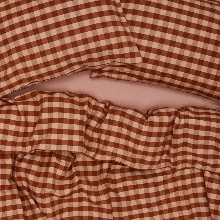 Essential Gingham Duvet - Blush/Terracotta on bed with matching pillow cases
