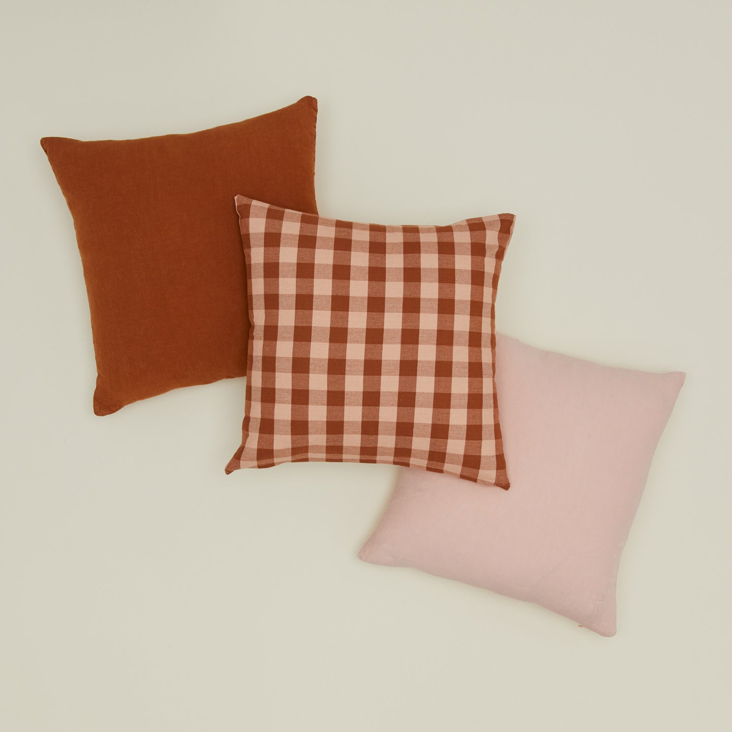 Essential gingham pillow in blush / terracotta with simple linen pillows in blush and terracotta