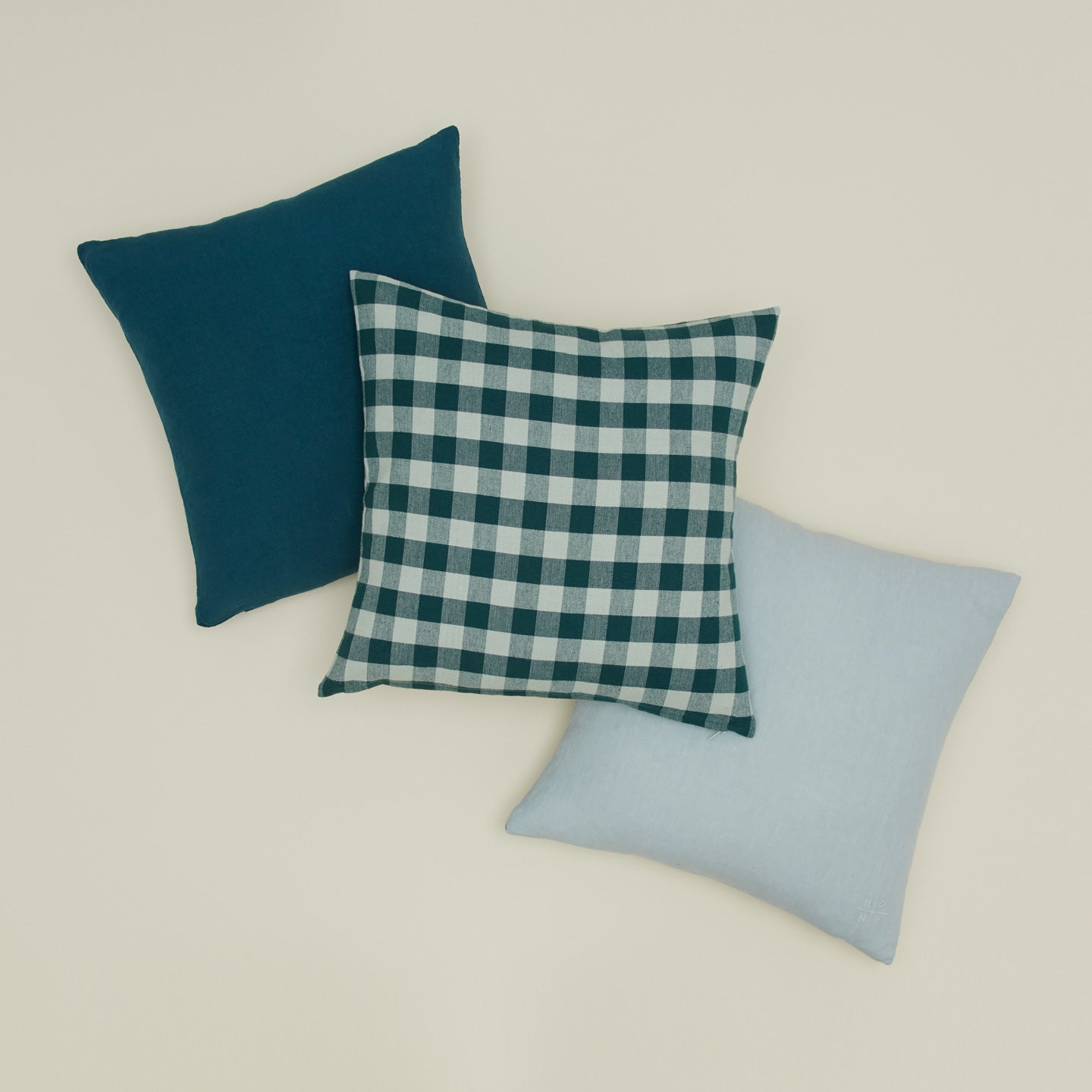 Essential gingham pillow and simple linen pillows in peacock and sky