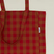 Close up view of Gingham tote bag in red/terracotta