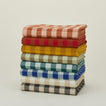Stack of Essential Gingham tablecloths in various colors