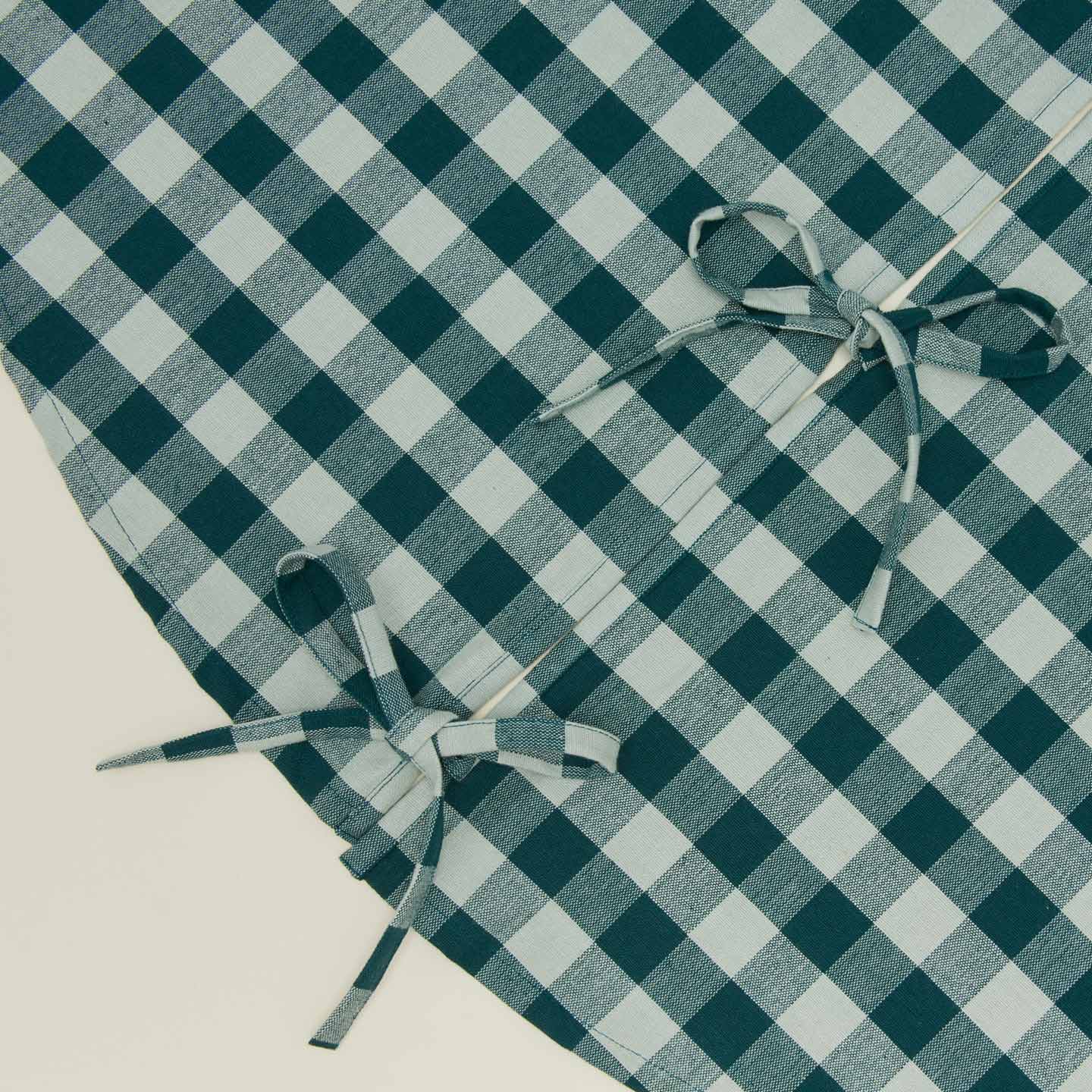 Detailed view of Essential GIngham Tree Skirt - Sky/Peacock