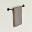 Small towel bar in Black with waffle dish towel.