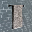 Essential towel bar in Black with Space Dye terry hand towel in Grey on tiled wall.