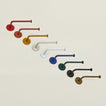 Toilet paper holders in a variety of colors.