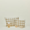 Essential gingham pouches in ivory and flax with hair care products