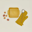 8" x 8" bakeware in mustard with potatoes, spoon, and oven mitt 