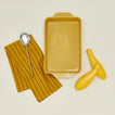 9x13 bakeware in mustard with squash dishtowel and spoon