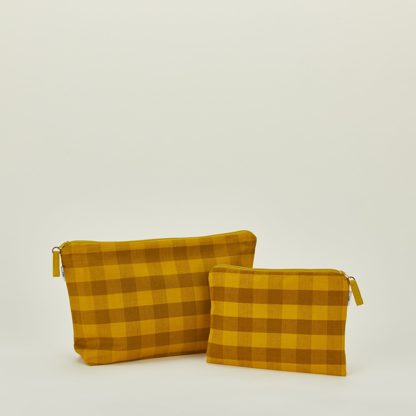Essential gingham pouches in mustard and bronze