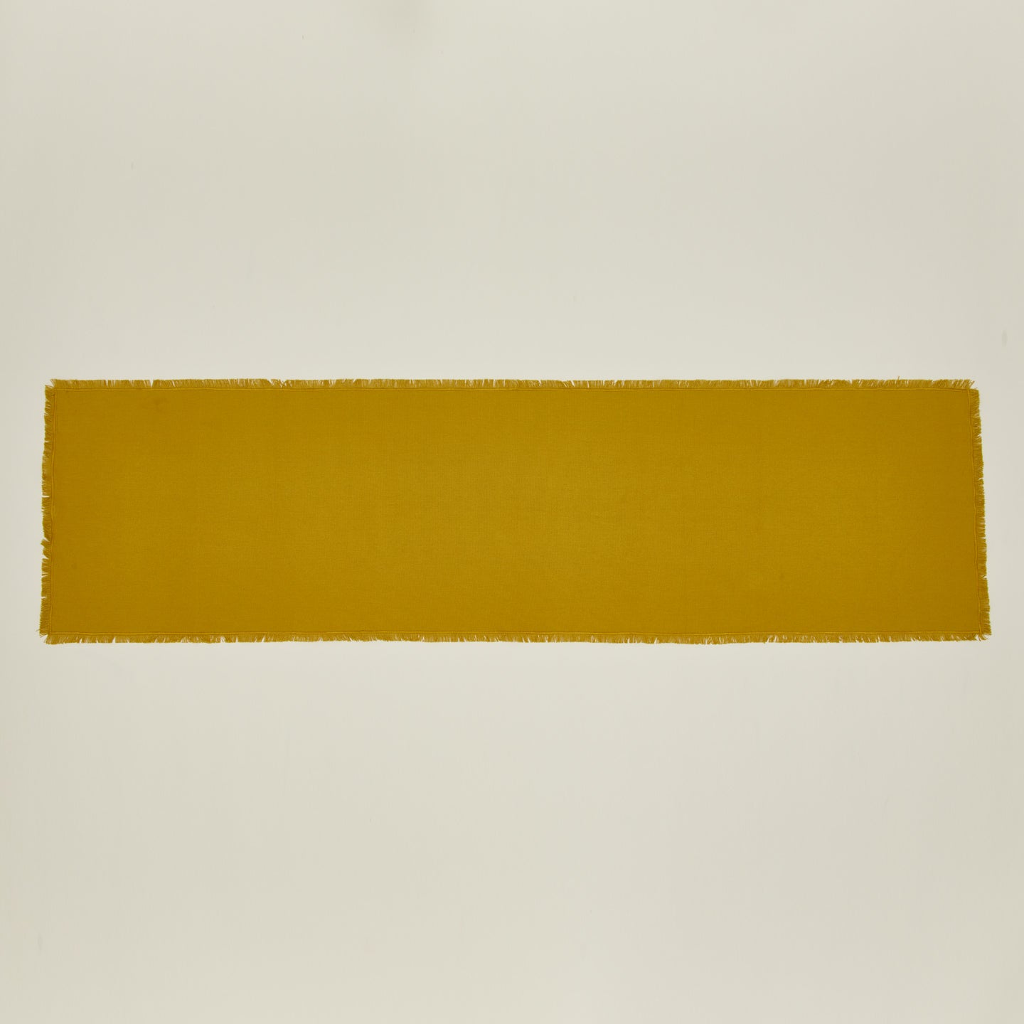 Overhead view of essential mustard runner