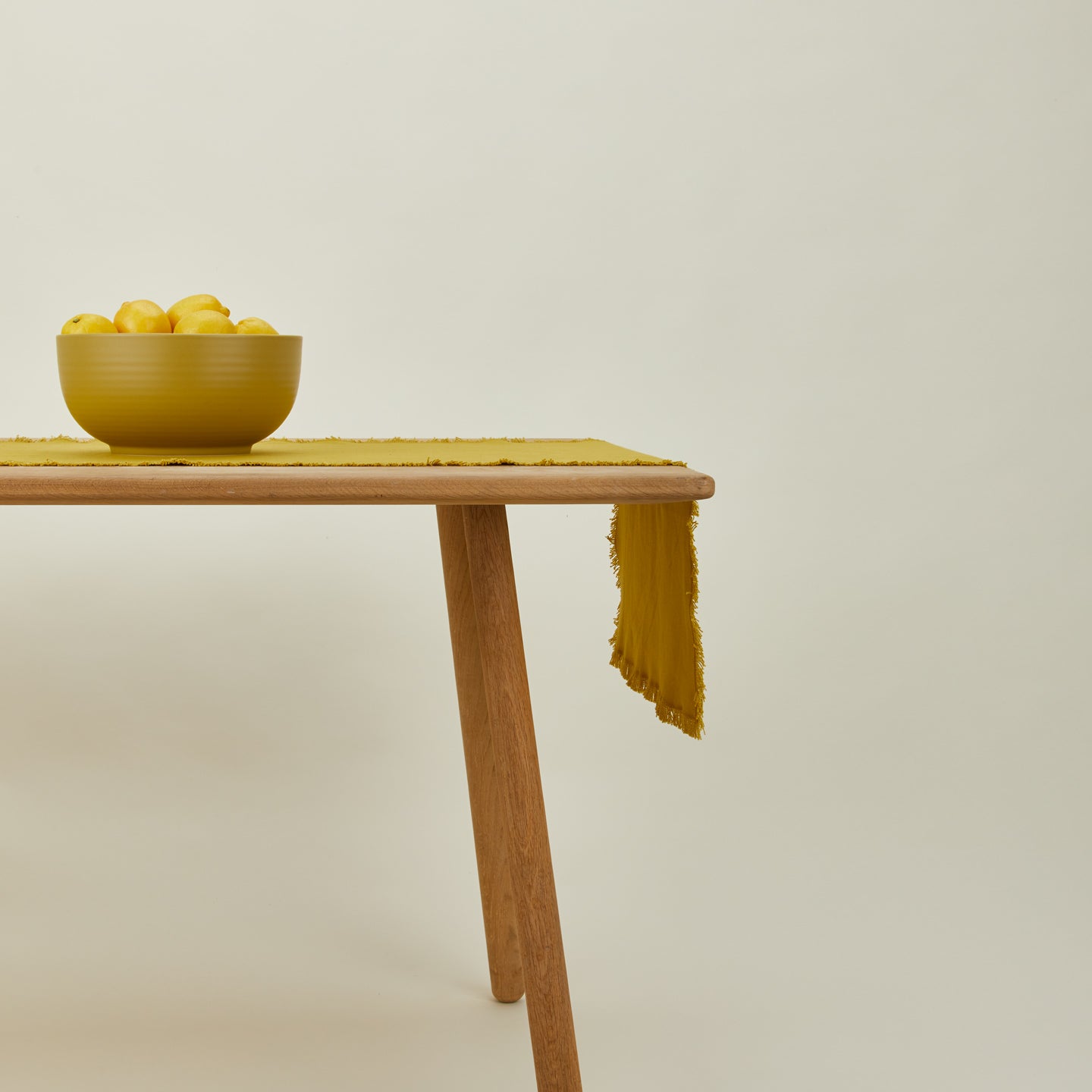 Essential mustard runner on table with serving bowl