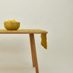 Essential mustard runner on table with serving bowl