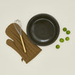 Pie dish in olive with limes, oven mitt, and whisk
