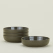 Four olive green Essential Low Bowls.