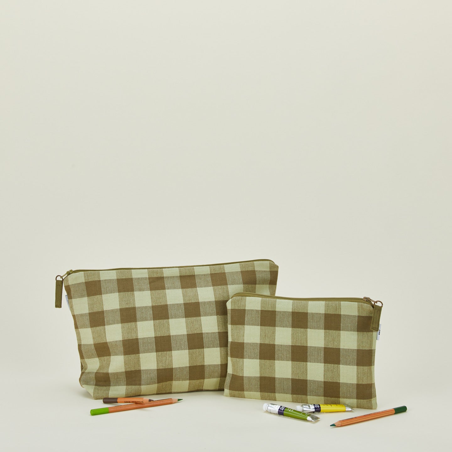 Essential gingham pouches in sage and olive with art supplies