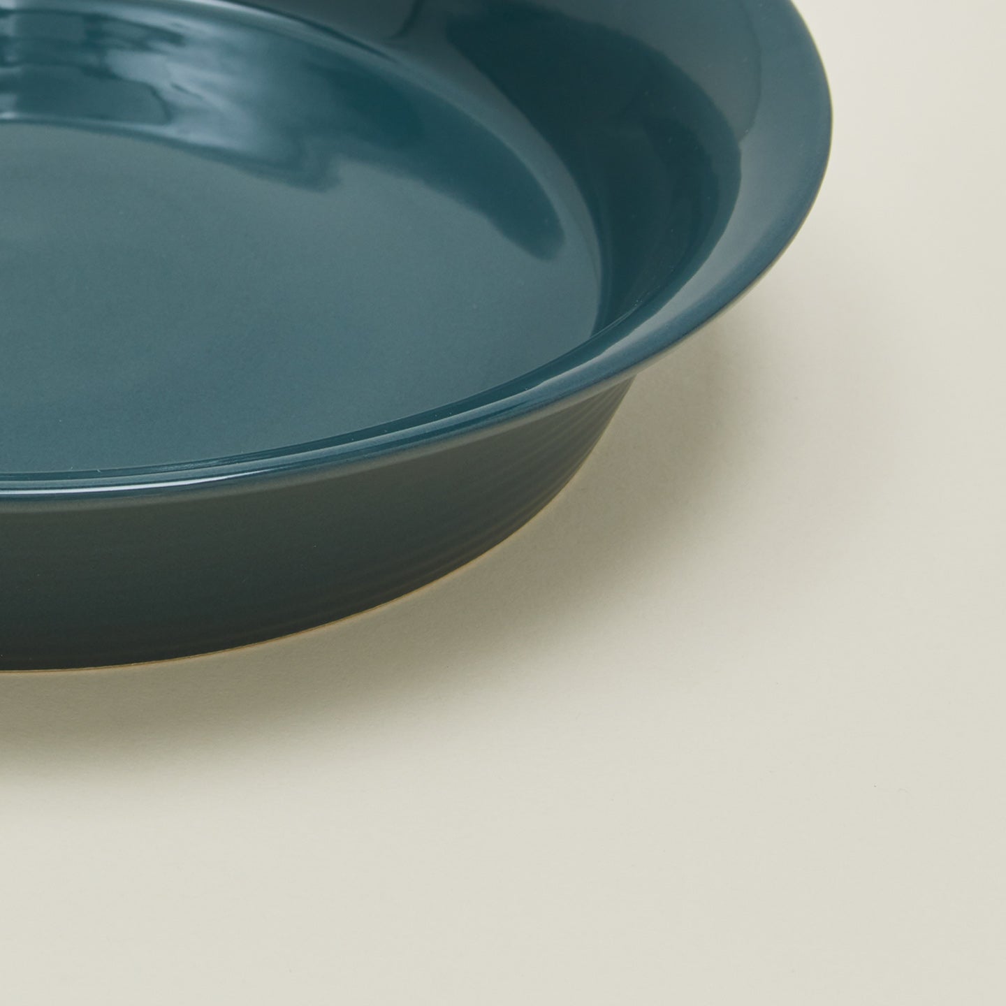 Close up view of Essential pie dish in peacock