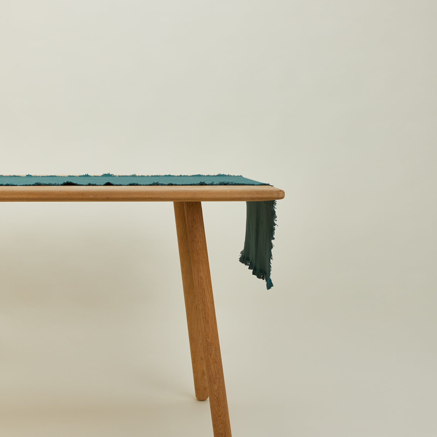 Essential peacock runner on table