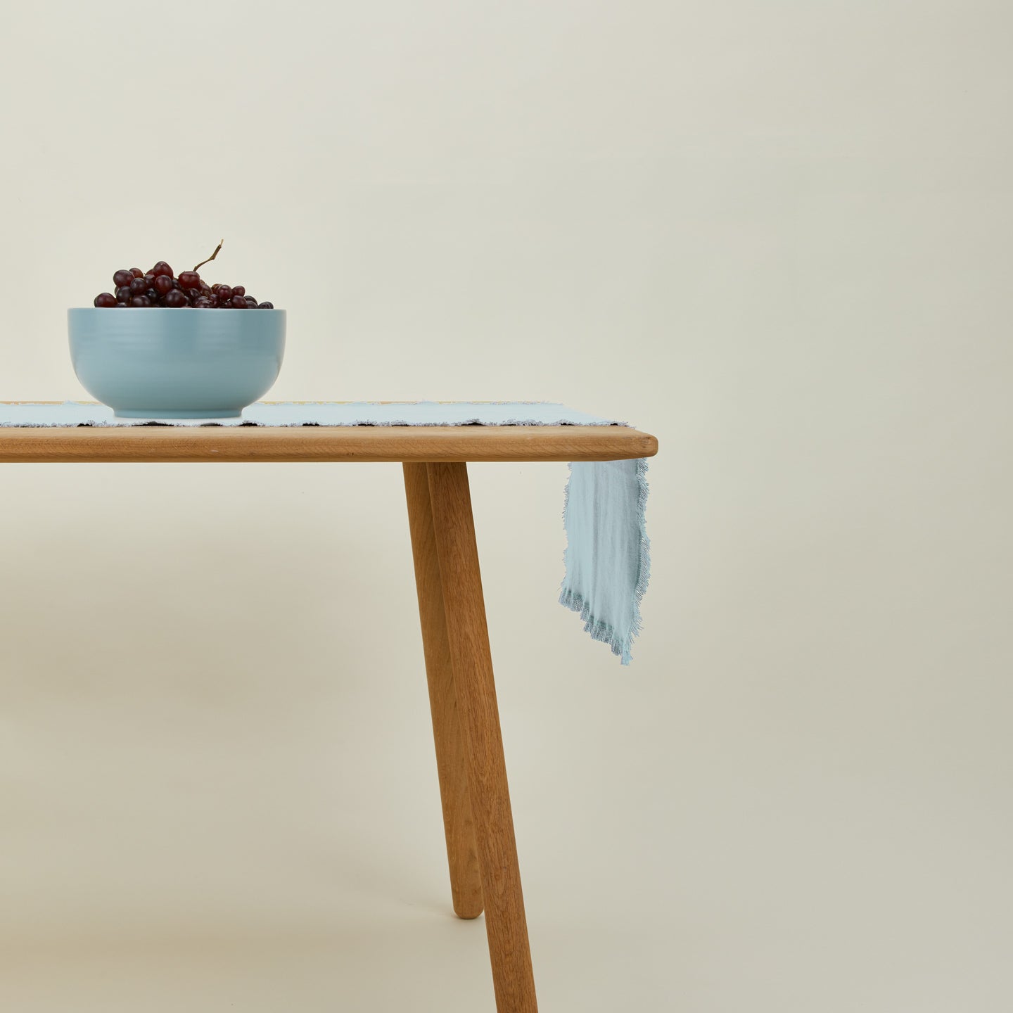Essential Table Runner in sky  on table with bowl