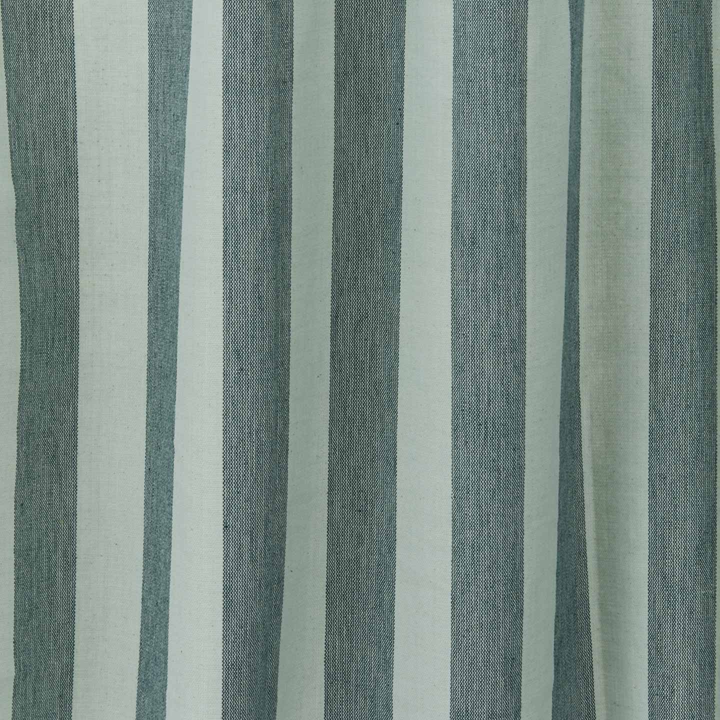 Close up view of essential striped shower curtain in sky / peacock